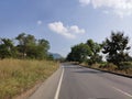 Beautiful road landscape image with vehicles and full of greenery from village in India Royalty Free Stock Photo