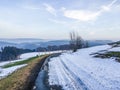 Beautiful road with melting snow in a countryside nature landscape with view over the mountains in Germany Hochsauerland Royalty Free Stock Photo