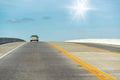 Beautiful road towards the sky with one car along the lane Royalty Free Stock Photo