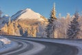 Beautiful roadscape, winter sunset in the mountains, winter outdoor travel background