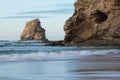 Beautiful rock cliff deux jumeaux in sunset sky on sandy beach of hendaye, basque country, france Royalty Free Stock Photo