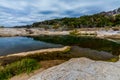 Beautiful Rock Formations Carved Smooth by the Crystal Clear Blue-Green Waters of the Pedernales River in Texas.