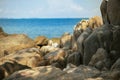 Beautiful rock texture and blue sea harbor of tropical island of Royalty Free Stock Photo