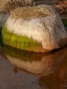 Beautiful rocks by the sea, colorful reflections in the water Royalty Free Stock Photo