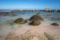 Beautiful rocky beach in Aruba. Big rocks in the foreground Royalty Free Stock Photo