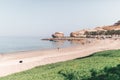 Beautiful rocky beach and palm trees next to the calm ocean Royalty Free Stock Photo