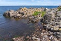 Beautiful rocky coast on the island of Bornholm, Denmark under the blue sky