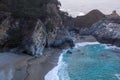 Beautiful rocky coastline with a scenic view of a McWay Falls in  Big Sur, California Royalty Free Stock Photo