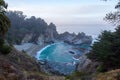 Beautiful rocky coastline with a scenic view of a McWay Falls in  Big Sur, California Royalty Free Stock Photo