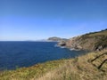 Beautiful rocky coastline with a seascape view in sunlight Royalty Free Stock Photo