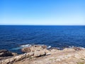 Beautiful rocky coastline with a seascape view in sunlight Royalty Free Stock Photo