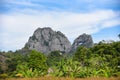 Beautiful rocky mountains on blue sky background, nature stone mountains with plant tree in the park Royalty Free Stock Photo