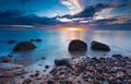 Beautiful rocky sea shore at sunrise or sunset. Royalty Free Stock Photo