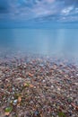 Beautiful rocky sea shore at sunrise or sunset. Royalty Free Stock Photo