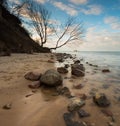 Beautiful rocky sea shore at sunrise or sunset. Royalty Free Stock Photo