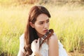 Beautiful asia girl white dress playing on a ukulele Royalty Free Stock Photo