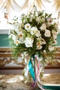 Beautiful romantic bouquet of white flowers with chamomiles in luxury interior Royalty Free Stock Photo