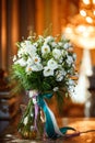 Beautiful romantic bouquet of white flowers with chamomiles in luxury interior Royalty Free Stock Photo