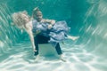 Beautiful romantic couple of lovers hugging gently under water