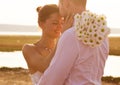 A beautiful romantic couple man and woman in white dresses, sun Royalty Free Stock Photo