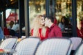 Beautiful romantic couple in Parisian outdoor cafe Royalty Free Stock Photo