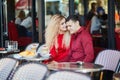 Beautiful romantic couple in Parisian outdoor cafe Royalty Free Stock Photo