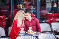 Beautiful romantic couple in Parisian outdoor cafe Royalty Free Stock Photo