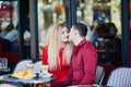 Beautiful romantic couple in Parisian outdoor cafe Royalty Free Stock Photo