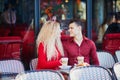 Beautiful romantic couple in Parisian outdoor cafe Royalty Free Stock Photo