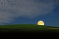 Beautiful romantic full moon over green tea hill in the evening