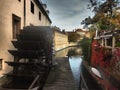 Beautiful romantic Prague, view of the river and old water mill with an interesting background