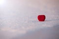 Beautiful romantic red heart box on a white snow. Royalty Free Stock Photo