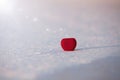 Beautiful romantic red heart on a white snow. Royalty Free Stock Photo