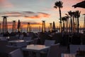 Beautiful Romantic Sunset at the Beach Cafe with Outdoor Patio Heaters Royalty Free Stock Photo