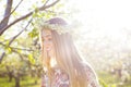 Beautiful romantic woman with long blond hair in a wreath of lily of the valley Royalty Free Stock Photo