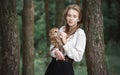 Beautiful romantic woman with an owl. The bird sits on her hand. Royalty Free Stock Photo