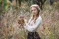 Beautiful romantic woman with an owl. The bird sits on her hand.