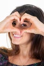 Beautiful romantic woman showing heart hand gesture I love you sign smiling happy on white background Royalty Free Stock Photo