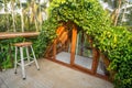 Beautiful rooftop bedroom with table and chair outside terrace with trees