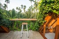 Beautiful rooftop bedroom with table and chair outside terrace with trees