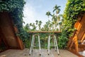 Beautiful rooftop bedroom with table and chair outside terrace with trees