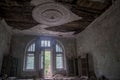 A beautiful room with shabby walls in an old abandoned house. Abandoned haunted manor. Royalty Free Stock Photo