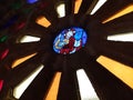 Beautiful Rose Window of a Romanesque monastery with stained glass windows of different colors and a figure in the middle. Ribeira Royalty Free Stock Photo