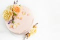Beautiful roses cake on wooden board Peach roses and lavender cake, Concept for Wedding , St. Valentine`s Day, Mother`s Day,