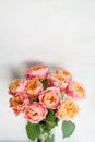 Beautiful roses flowers in a vase on a table . Bouquet of pink and orange multicolor flower. Decoration of home Royalty Free Stock Photo