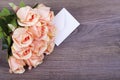 Beautiful roses with a note in the envelope Royalty Free Stock Photo