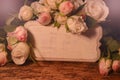 Beautiful roses with vintage board Royalty Free Stock Photo