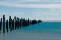 Beautiful rotten mooring on a beach Royalty Free Stock Photo