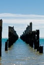 Beautiful rotten mooring on a beach Royalty Free Stock Photo