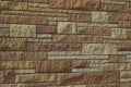 Beautiful limestone brick wall texture with stone blocks in varying sizes and shades of brown Royalty Free Stock Photo